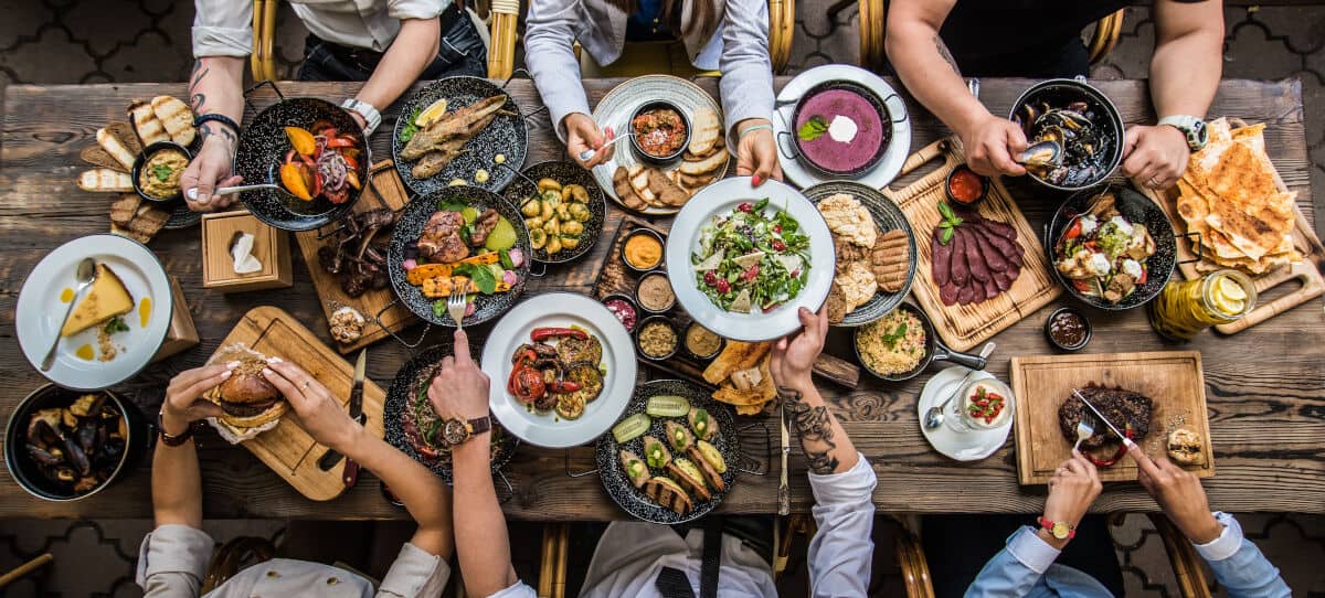 Overhead shot of a large spread of food at a cookout