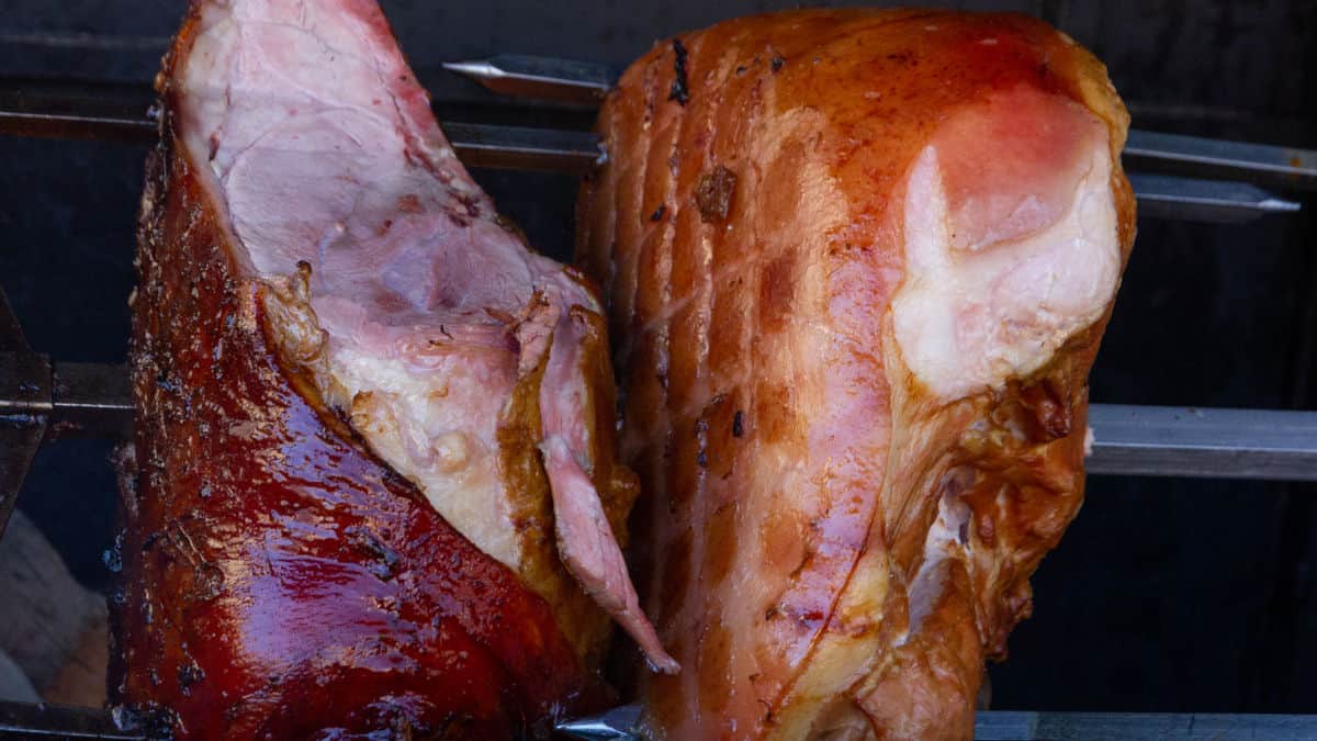 Two hams sitting in a smoker