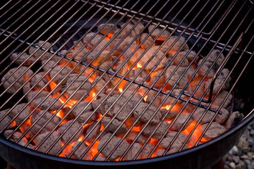 Lit charcoal inside a grill