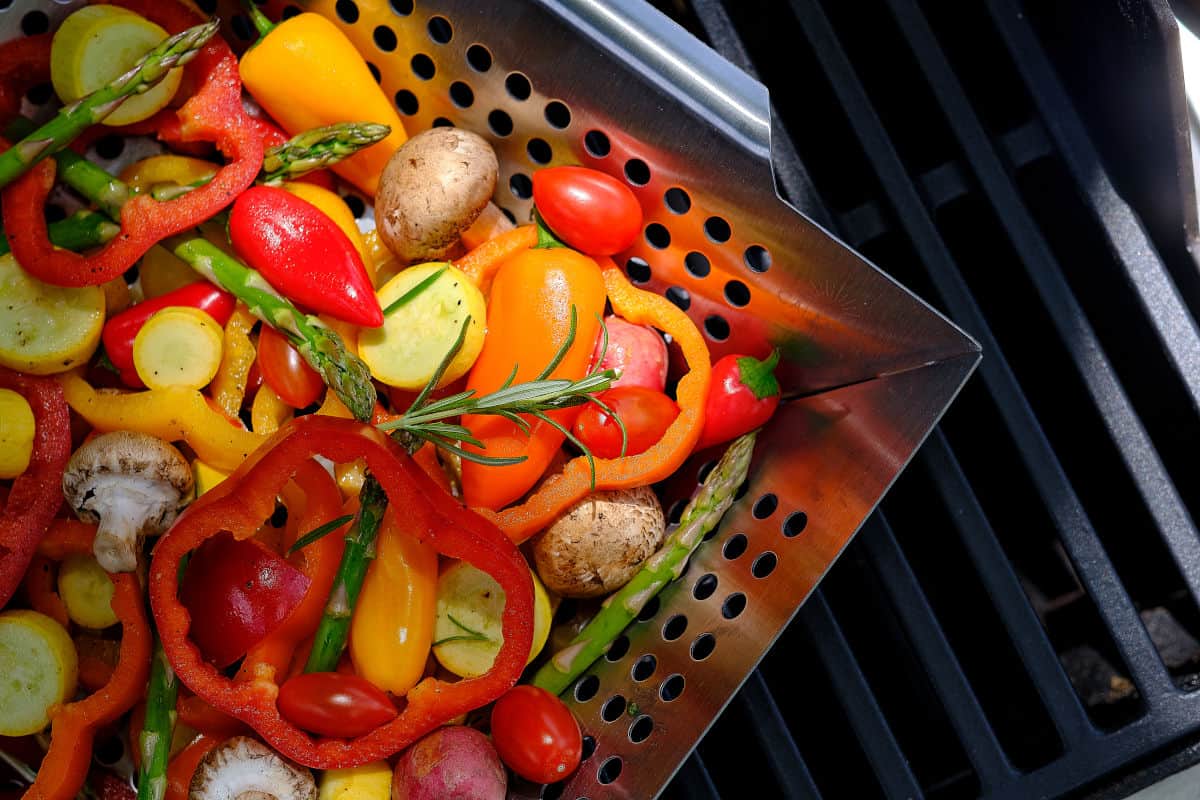 Lots of colorful vegetables in an open grill basket