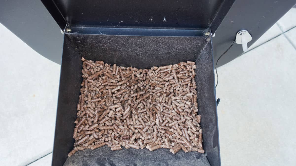 Wood pellets in the hopper of a portable pellet grill