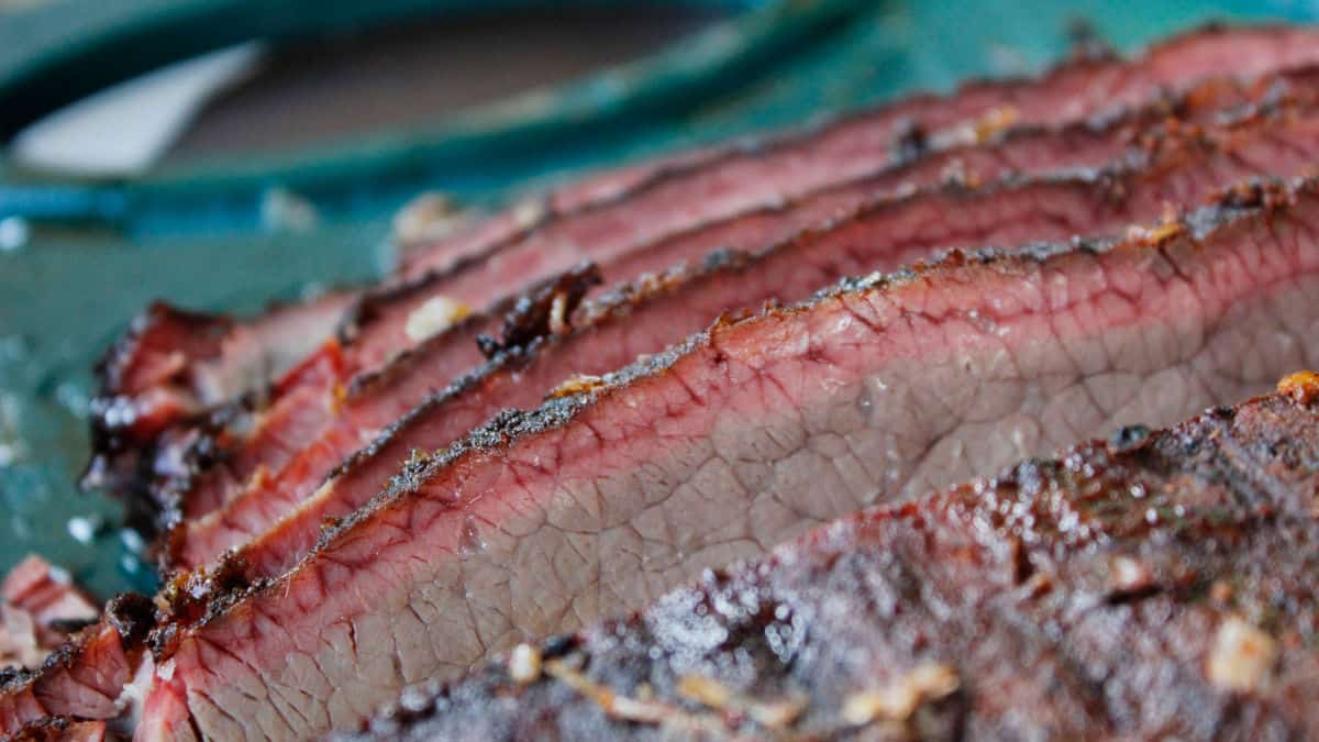 Close up of a bbq smoke ring on a few slices of beef brisket