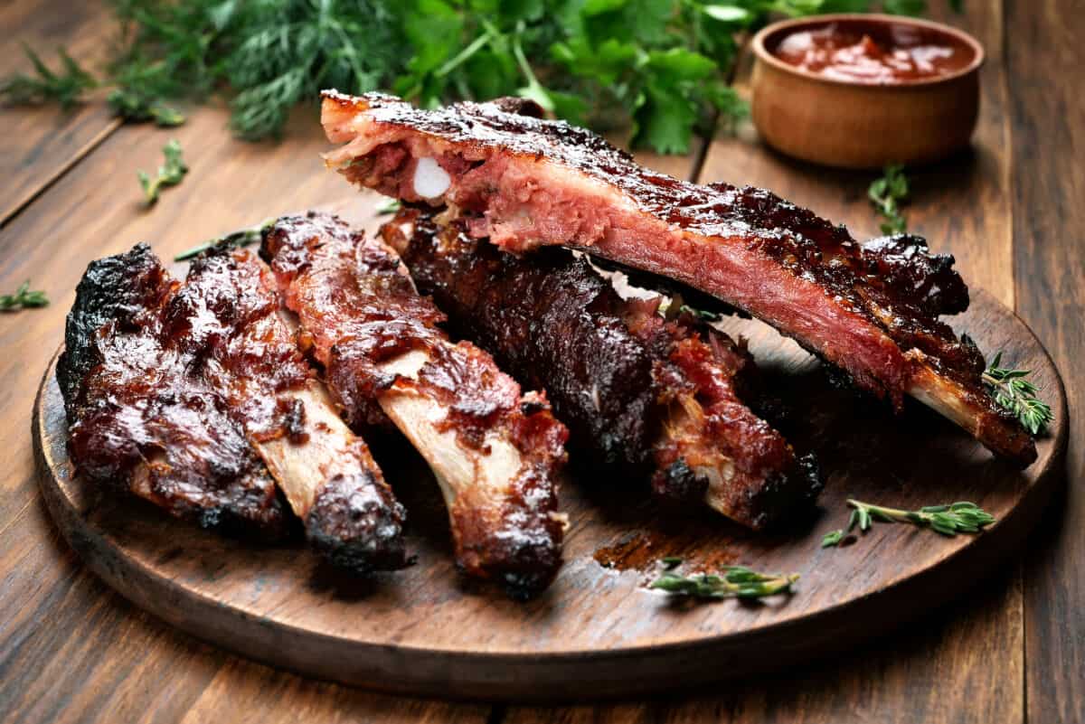 Not very meaty pork ribs on a round cutting board